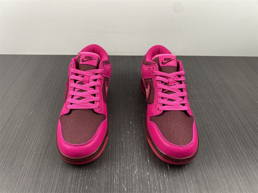 from Nike Spruces Up Its Dunk Low Team Red/Pink DQ9324-600