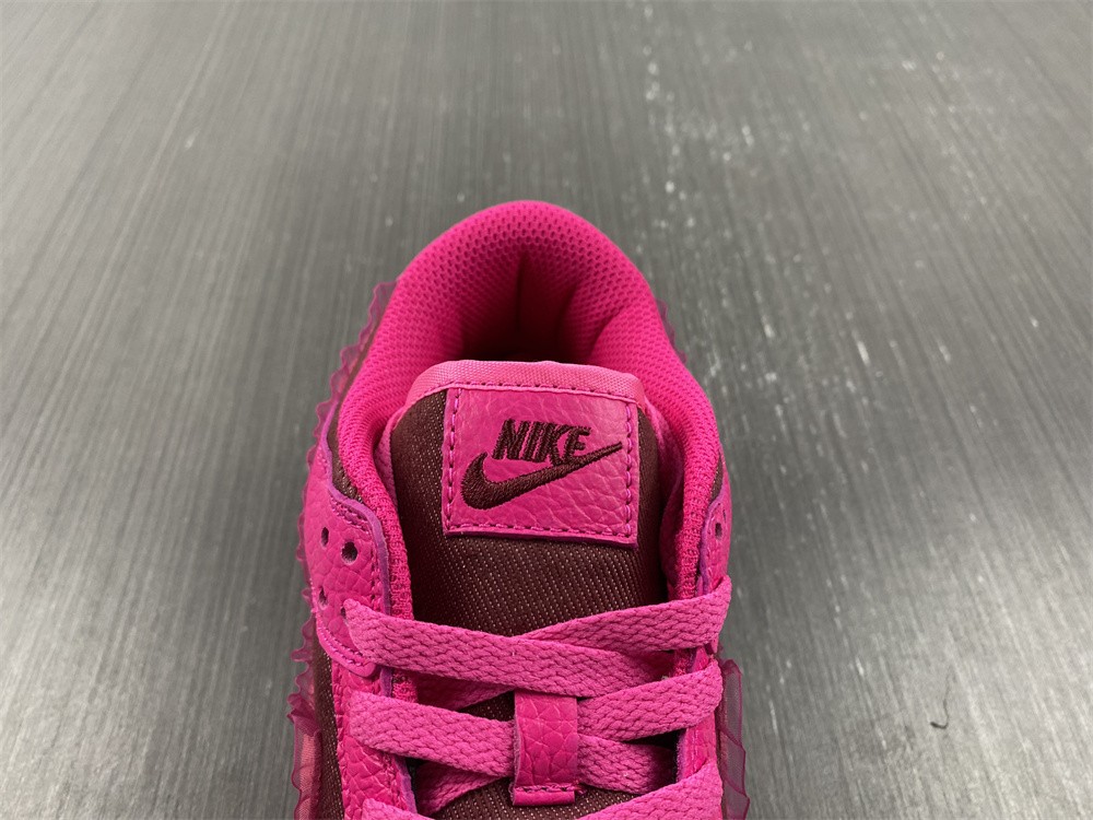 from Nike Spruces Up Its Dunk Low Team Red/Pink DQ9324-600