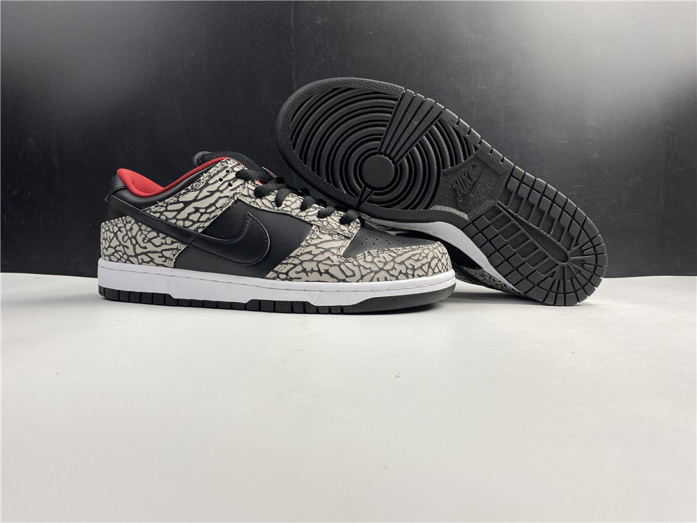 from Supreme × Nike SB Dunk Low “Black Cement 304292-131